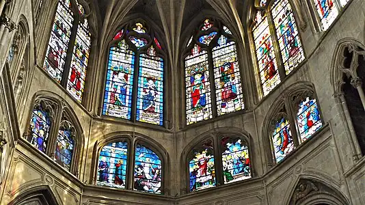 Upper windows of the apse; portraits of the Saints