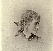 A black and white photograph of Frances Richards, shown in profile. Her head is turned to the right. She is wearing a high-collared dress and her hair is pulled back.