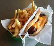 A francheezie with a side of fries; the cheese is on top instead of inside