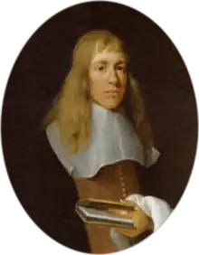 A man with long fair hair in 17th century dress