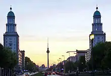 The Berlin TV tower, far in the distance, sits exactly between the twin towers on the western side of the square.