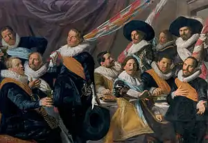 Olycan as the seated central figure in Officers of the St. George Civic Guard, Haarlem, 1627