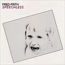 The album cover is white with a grey rectangle in the center tilted downwards to the left. In the center of the rectangle is a black-and-white photograph of the head and shoulders of a crying child. In the top left corner of the cover, on the white background, is the text "FRED FRITH" in black, with the text "SPEECHLESS" underneath it in red.