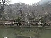 A statue of Guanyin stands on the Free Life Pond, Guangji Temple.