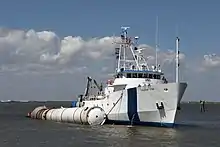 A recovery boat with a recovered Solid Rocket Booster