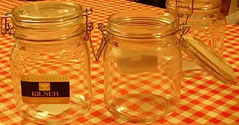 Flip-top or bail closure on storage jar