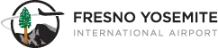 Logo of a plane flying past a sequoia tree and Yosemite’s Half Dome in a circle, next to the words Fresno Yosemite International Airport