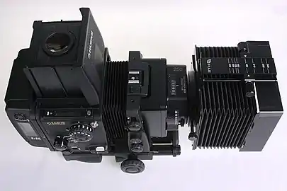 Fuji GX680III Professional Body with Long-Bellows, Folding Waist-level Finder with flipped up Magnifier, Roll Film Holder IIIN (portrait orientation) and EBC Fujinon Lens GX 250mm 1:5.6 with mounted Bellows Lens Shade II