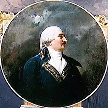 Painting of a black-moustached man in a white 18th century wig. He wears a blue 1790s style military coat with gold trim.