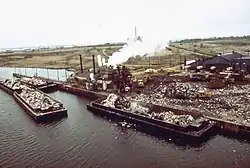 Garbage scows bring solid waste to Plant #2 at Fresh Kills Landfill in 1973
