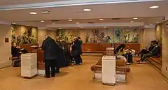 Wood benches in the small square waiting room