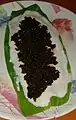 Chûn and rice paste smeared on turmeric leaf