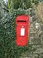 GVIR wall box in a rural location near Darley Dale church, Derbyshire, England.