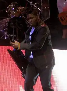 A color picture of ska musician Gabrial McNair performing.