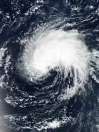 Tropical Storm Gabrielle over the open ocean on September 4. It is somewhat asymmetrical and has an oval shape.