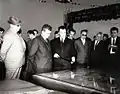 Nicolae Ceaușescu being shown plans of the steel works (1966)