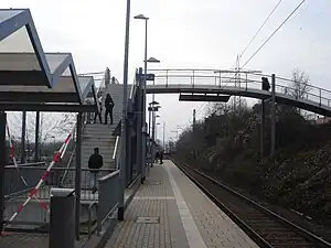 Pedestrian bridge crossing a single railway track with side platform
