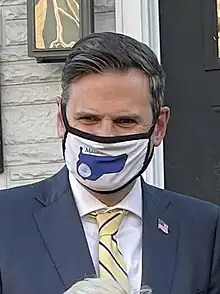 Photograph of Gary Christenson, a white man in his 50s with brown and gray hair. In the photograph, Christenson is wearing a face mask due to the then-ongoing COVID-19 pandemic