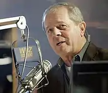 A man speaking into a microphone