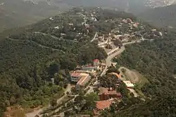 Aerial view of Bruguers, with the Hermitage near bottom center