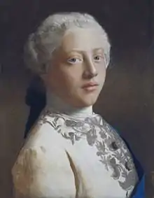 Head-and-shoulders portrait of a young clean-shaven George wearing a finely-embroidered jacket, the blue sash of the Order of the Garter, and a powdered wig.