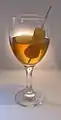 German ginger-flavored wine (grape-based) with stem ginger decoration