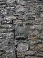 The 'Eagle' from Giffen Castle, now in the lower gable wall of Giffen mill