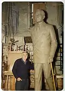 Gilbert A. Franklin posing with Truman statue (c. 1975)