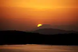 Sunset over Giritale Wewa and mountains