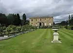 a lawn in front of a country house