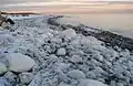 Glatved beach, iced over stony coast.