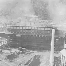 Retorts and shale conveyor from storage bins c.1947.