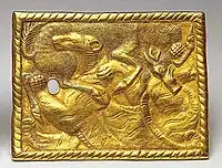 Gold belt buckle inscribed with Chinese characters found in Xigoupan M2 (4th-3rd century BCE)