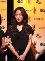 Ivy Yin being interviewed at an award ceremony