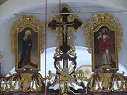 The three icons on the top of the iconostasis