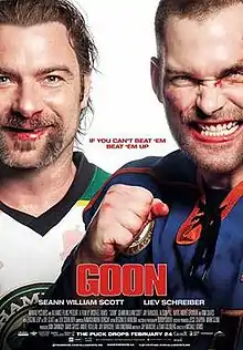 Two smiling bleeding hockey players, one with a fist raised