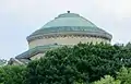 The dome of the Gould Memorial Library can be seen above the trees from many locations in Upper Manhattan