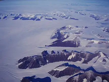 Southward bend in the Christian IV Glacier with the Gronau Nunataks in the background and the NW part of the Watkins Range on the right
