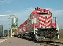 A Wisconsin and Southern grain train loads at a co-op in Rock Springs, Wisconsin