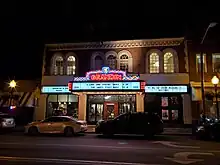 A nighttime photo of the exterior of the Grandin Theatre