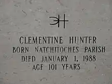 Inscription on gravestone reads. Distinctive signature, backwards C interlocking with H. Clementine Hunter, Born Natchitoches Parish, Died January 1, 1988, Age 101 Years.