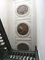 Great Potheridge House, staircase ceiling c.1660-70 with plasterwork wreaths enclosing allegorical paintings with putti, one riding on the back of an  eagle holding a crown in its talons, the middle one of a bare breasted female