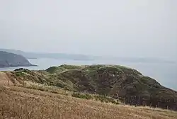 The fort, viewed from the west with the Pembrokeshire Coast Path in the foreground