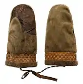 Men's seal fur mittens with sealskin palm and trim. East Greenland Inuit, Ammassalik distrikt, Tasiilak