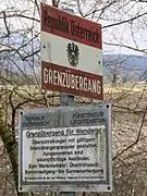 Looking at an Austria border sign.