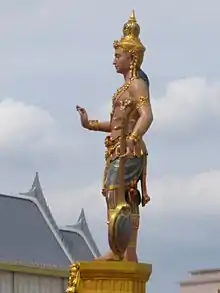 Dhṛtarāṣṭra of the east direction, king of gandharvas.