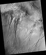 Group of gullies, as seen by HiRISE under the HiWish program.  Location is Thaumasia quadrangle.