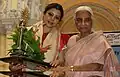 Bhattacharyaa, the Odissi Dancer receiving Raas Ratna Award from Padma Bhusan Girija Devi