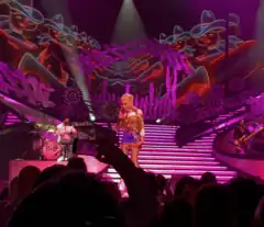 A color photograph of Gwen Stefani performing live.