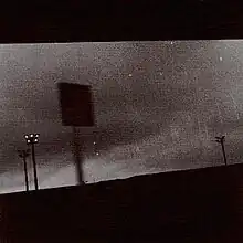 A grainy black-and-white photo of billboards.